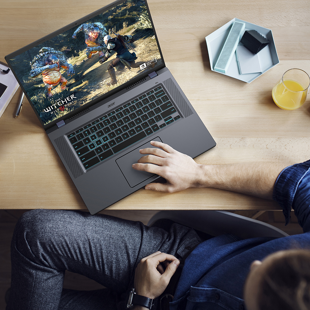 High angle view of man using laptop computer while sitting at table