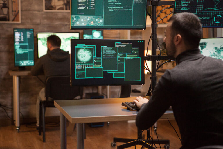 Back view of dangerous team of hackers